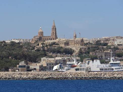 A classic “get-away-from-it-all” destination, Gozo enjoys a slower pace of life. The island’s largest city, Victoria (population about 6,500), is laidback, with elderly locals whiling away the afternoon on shady park benches. Gozo’s beach towns get busy during the high summer season but the island’s interior, with its vineyards, farm houses, and rugged landscape, seem to belong to an earlier time.